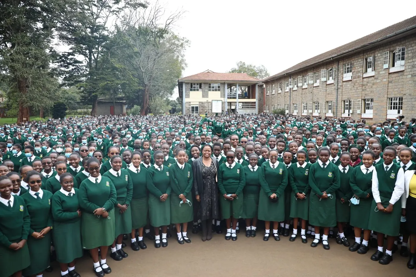 Alliance Girls' students gathered with a distinguished visitor